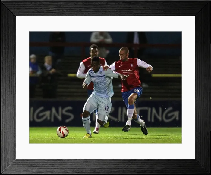 Framed Print : Intense Rivalry: Franck Moussa vs Matty Blair in the Johnstones Paint Trophy Northern Section Clash between Coventry City and York City Framed Print : Intense Rivalry: Franck Moussa vs Matty Blair in the Johnstones Paint Trophy Northern Section Clash between Coventry City and York City