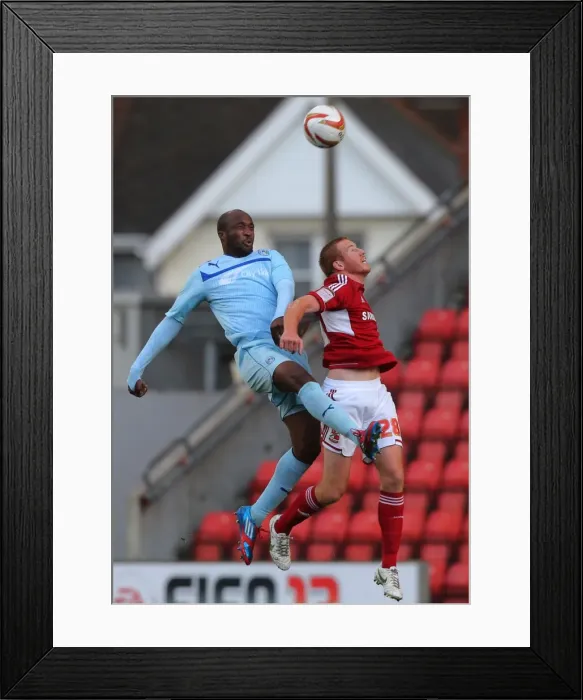 Framed Print : Coventry City's Nathan Cameron Outjumps Swindon Town's Adam Rooney: A Head-to-Head Battle in Npower League One