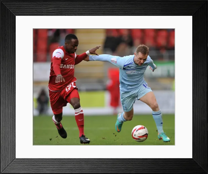 Framed Print : Clash of the Wings: McSheffrey vs. Odubajo in Coventry City's Npower League One Battle at Leyton Orient Framed Print : Clash of the Wings: McSheffrey vs. Odubajo in Coventry City's Npower League One Battle at Leyton Orient