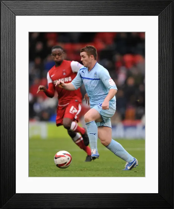 Framed Print : Fleck vs. Odubajo: A Battle of Wills in Coventry City's Npower League One Clash with Leyton Orient Framed Print : Fleck vs. Odubajo: A Battle of Wills in Coventry City's Npower League One Clash with Leyton Orient