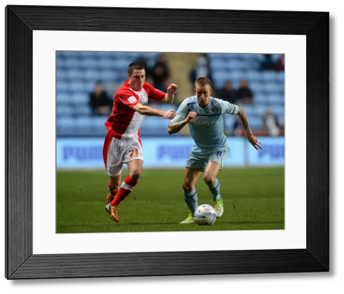 Framed Print : Clash of the Midfielders: Coventry City's Carl Baker vs Crawley Town's Mike Jones (Football League One, Ricoh Arena, 06-11-2012)