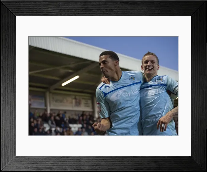 Framed Print : Coventry City's Triumph: Franck Moussa and Carl Baker's Euphoric Moment after Scoring the Third Goal vs. Hartlepool United in Football League One