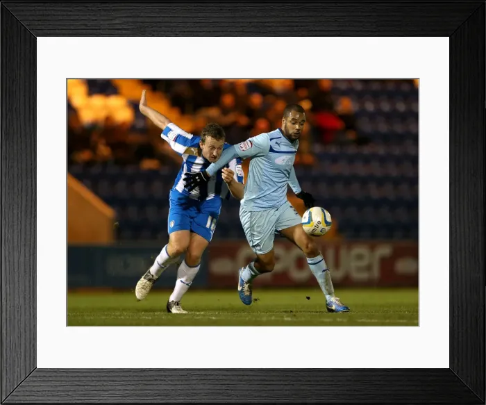 Framed Print : Battle for the Ball: Eastman vs. McGoldrick in Npower League One Clash Framed Print : Battle for the Ball: Eastman vs. McGoldrick in Npower League One Clash