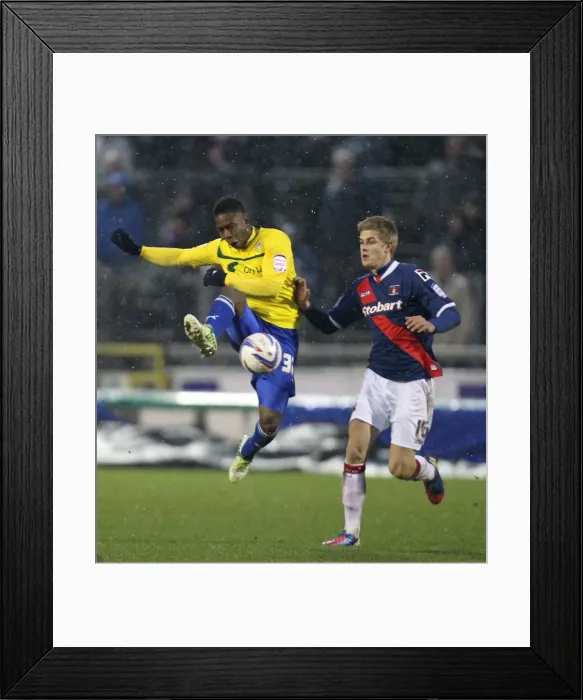 Framed Print : Franck Moussa's Aerial Mastery: Coventry City vs Carlisle United (Brunton Park, 13-01-2013) Framed Print : Franck Moussa's Aerial Mastery: Coventry City vs Carlisle United (Brunton Park, 13-01-2013)