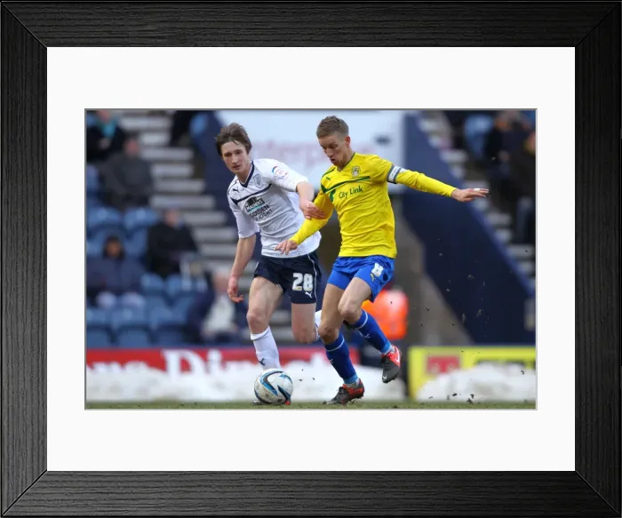 Framed Print : Battling for Possession: Davies vs. Baker in Preston North End vs. Coventry City Framed Print : Battling for Possession: Davies vs. Baker in Preston North End vs. Coventry City