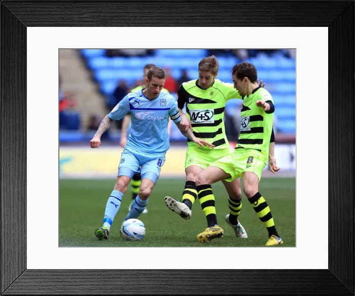 Framed Print : Intense Triangle Tackle: Carl Baker vs. Sam Foley and Edward Upson (Coventry City vs. Yeovil Town, Npower League One) Framed Print : Intense Triangle Tackle: Carl Baker vs. Sam Foley and Edward Upson (Coventry City vs. Yeovil Town, Npower League One)