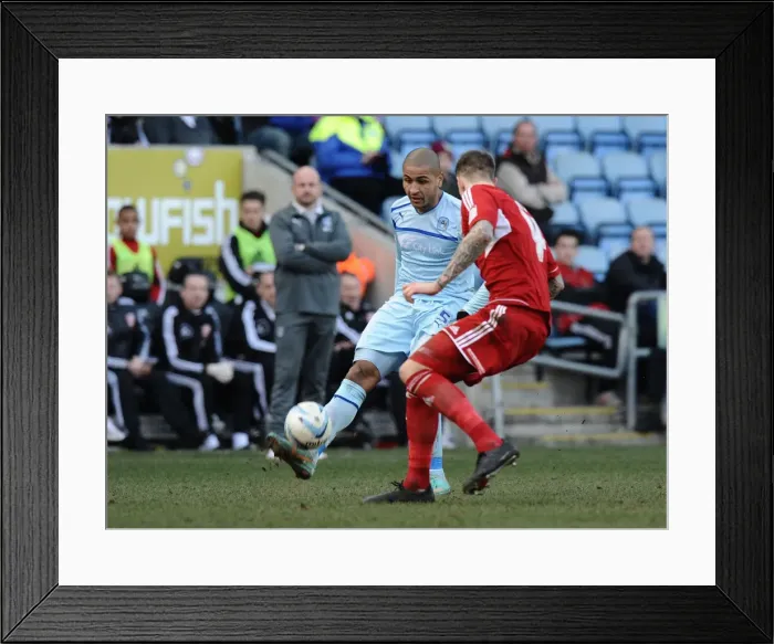 Framed Print : Leon Clarke vs Aden Flint: Intense Rivalry in Coventry City vs Swindon Town League One Clash at Ricoh Arena Framed Print : Leon Clarke vs Aden Flint: Intense Rivalry in Coventry City vs Swindon Town League One Clash at Ricoh Arena