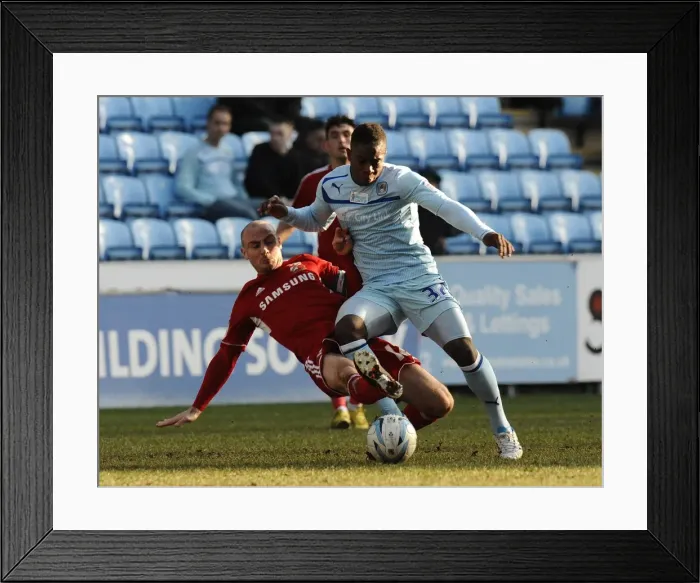 Framed Print : Intense Rivalry: Franck Moussa vs. Alan McCormack's Fierce Tackle in Coventry City vs. Swindon Town (Npower League One, 02-03-2013) Framed Print : Intense Rivalry: Franck Moussa vs. Alan McCormack's Fierce Tackle in Coventry City vs. Swindon Town (Npower League One, 02-03-2013)