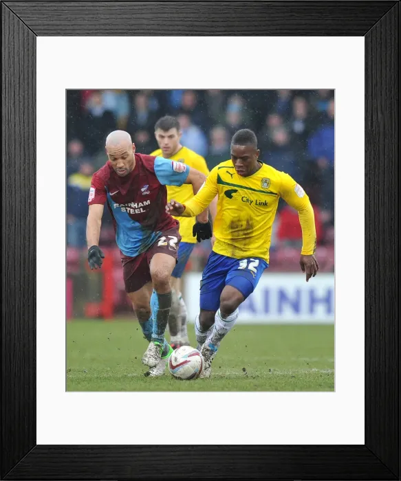 Framed Print : Intense Rivalry: Franck Moussa vs. Karl Hawley at Glanford Park - Coventry City vs. Scunthorpe United (Npower League One, March 2013) Framed Print : Intense Rivalry: Franck Moussa vs. Karl Hawley at Glanford Park - Coventry City vs. Scunthorpe United (Npower League One, March 2013)