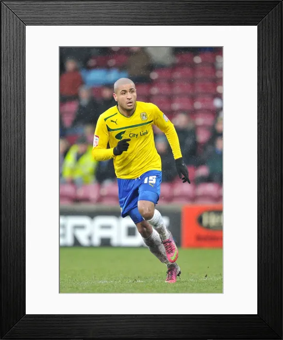 Framed Print : Leon Clarke Leads Coventry City at Glanford Park Against Scunthorpe United in Football League One