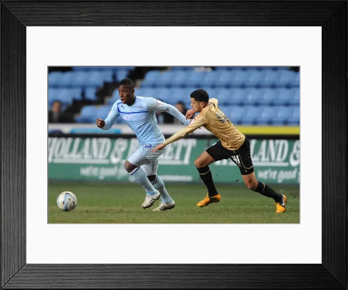 Framed Print : Battle for the Ball: Franck Moussa vs. Billy Clifford - Coventry City vs. Colchester United in Npower League One Framed Print : Battle for the Ball: Franck Moussa vs. Billy Clifford - Coventry City vs. Colchester United in Npower League One