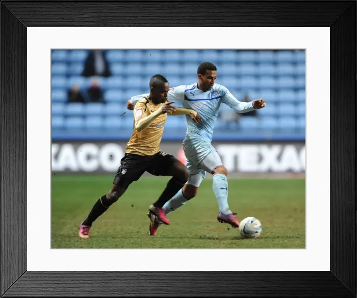 Framed Print : Intense Rivalry: Cyrus Christie vs. Gavin Massey's Battle for Ball Supremacy in Coventry City vs. Colchester United (Npower Football League One, Ricoh Arena, 12-3-2013) Framed Print : Intense Rivalry: Cyrus Christie vs. Gavin Massey's Battle for Ball Supremacy in Coventry City vs. Colchester United (Npower Football League One, Ricoh Arena, 12-3-2013)