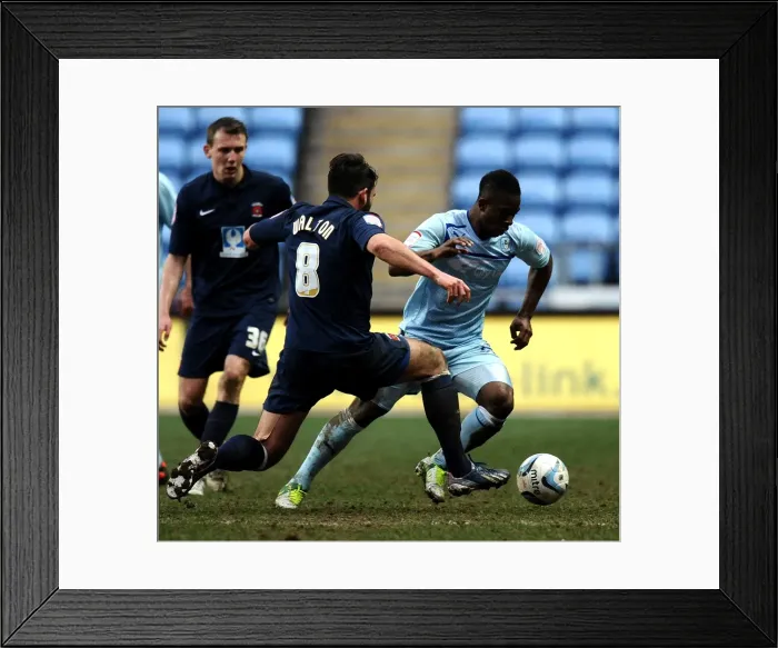 Framed Print : Intense Rivalry: Franck Moussa vs. Simon Walton - Coventry City vs. Hartlepool United Npower League One Clash at Ricoh Arena Framed Print : Intense Rivalry: Franck Moussa vs. Simon Walton - Coventry City vs. Hartlepool United Npower League One Clash at Ricoh Arena