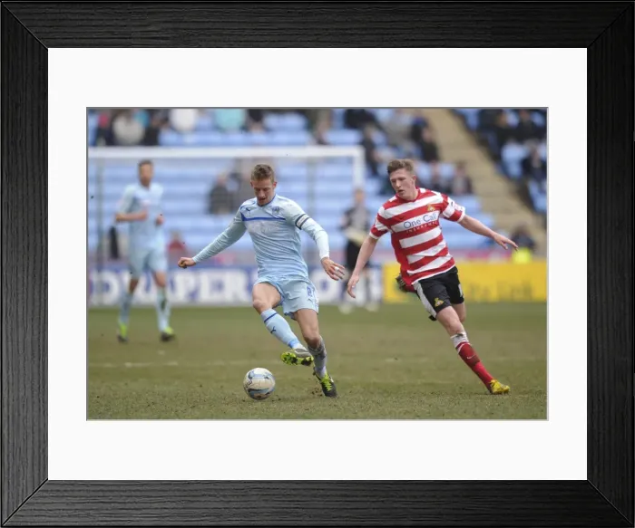 Framed Print : Coventry City vs Doncaster Rovers: A Battle in Npower Football League One - Carl Baker vs John Lundstram at Ricoh Arena