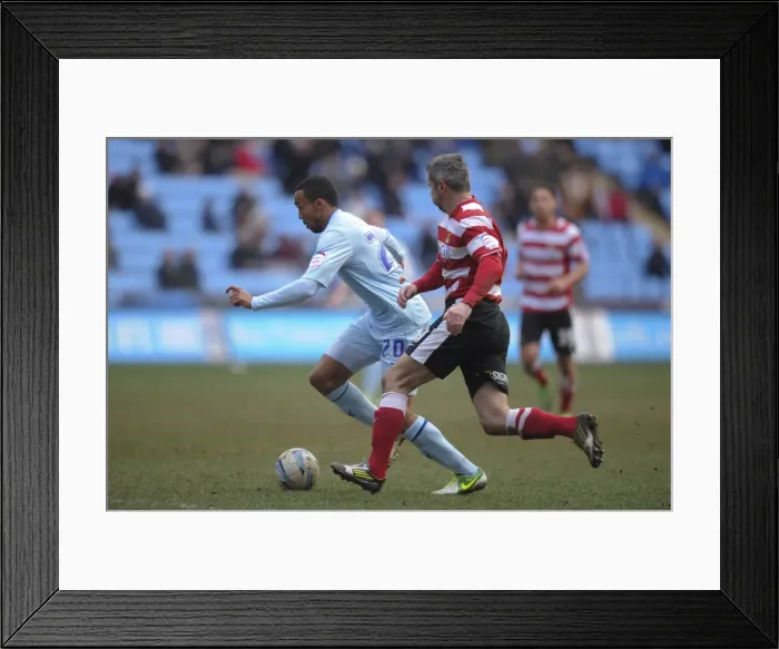 Framed Print : Intense Rivalry: Callum Wilson vs. Andy Griffin - Coventry City vs. Doncaster Rovers, Npower League One at Ricoh Arena Framed Print : Intense Rivalry: Callum Wilson vs. Andy Griffin - Coventry City vs. Doncaster Rovers, Npower League One at Ricoh Arena