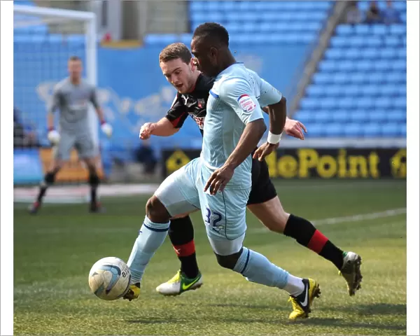 Intense Rivalry: Franck Moussa vs. Lee Hodson in Coventry City vs. Brentford Football League One Clash