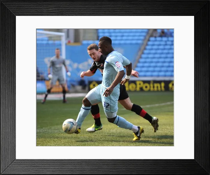 Framed Print : Intense Rivalry: Franck Moussa vs. Lee Hodson in Coventry City vs. Brentford Football League One Clash Framed Print : Intense Rivalry: Franck Moussa vs. Lee Hodson in Coventry City vs. Brentford Football League One Clash