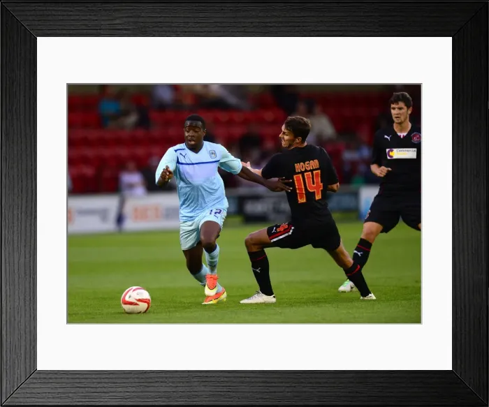 Framed Print : Coventry City vs Fleetwood Town: A Pre-Season Battle - Eli Bako vs Liam Hogan (July 24, 2013)