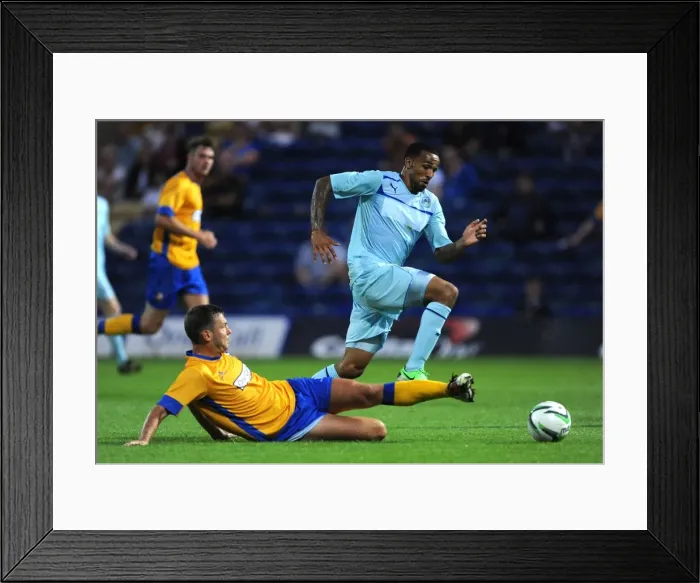 Framed Print : Callum Wilson's Agile Escape: Overcoming John Dempster in the Mansfield Town Friendly (July 26, 2013)