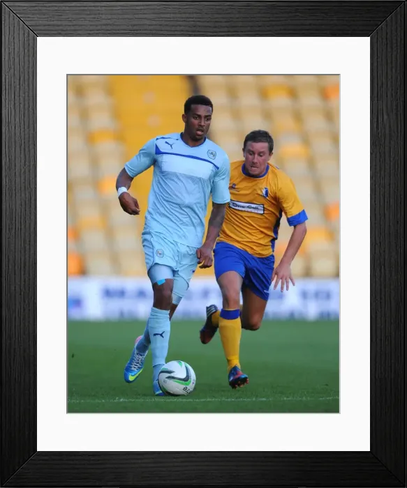 Framed Print : Battle for the Ball: McGuire vs. Christie, Mansfield Town vs. Coventry City Friendly Framed Print : Battle for the Ball: McGuire vs. Christie, Mansfield Town vs. Coventry City Friendly
