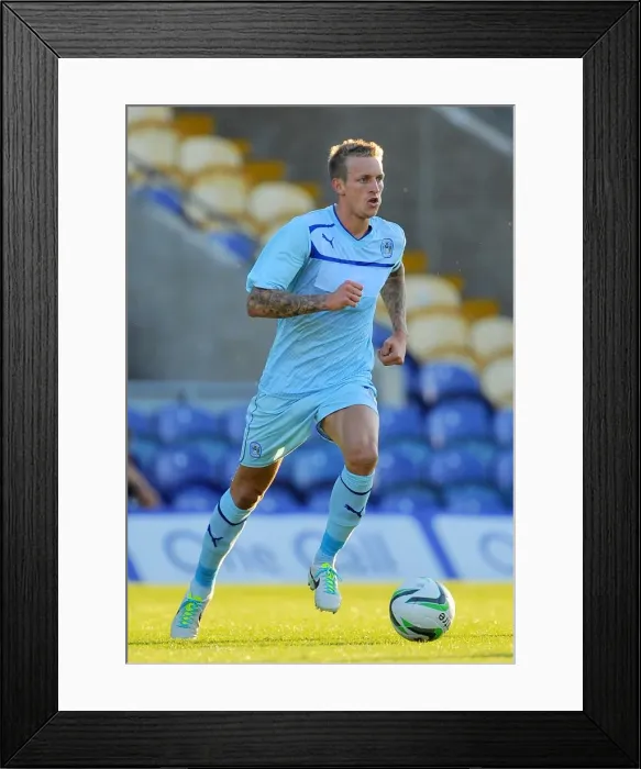 Framed Print : Carl Baker in Action: Coventry City's Star Midfielder at Mansfield Town Friendly, July 2013 Framed Print : Carl Baker in Action: Coventry City's Star Midfielder at Mansfield Town Friendly, July 2013