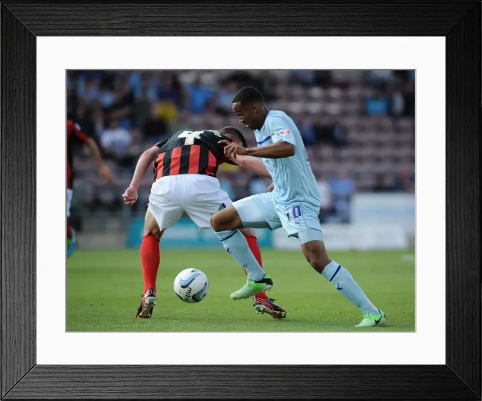 Framed Print : Callum Wilson Outsmarts Paul Huntington: Coventry City vs Preston North End Championship Showdown at Sixfields Stadium