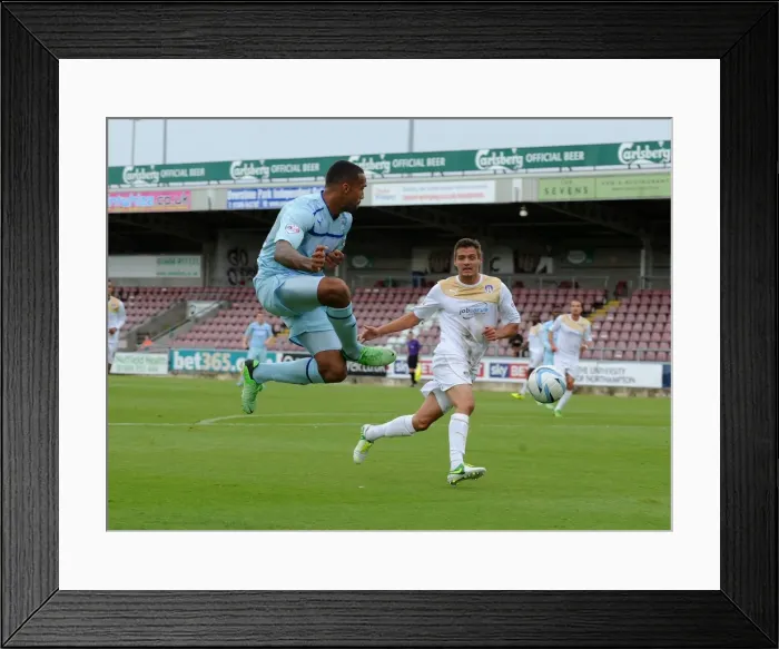Framed Print : Callum Wilson Sends a Soaring Cross at Sixfields Stadium during Coventry City vs Colchester United (Sky Bet Football League One, 2013) Framed Print : Callum Wilson Sends a Soaring Cross at Sixfields Stadium during Coventry City vs Colchester United (Sky Bet Football League One, 2013)