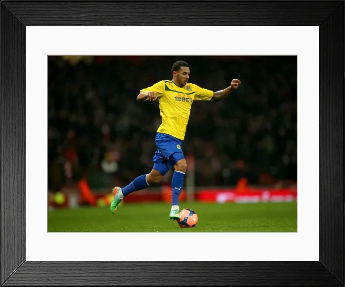 Framed Print : Coventry City's Cyrus Christie Takes on Arsenal at Emirates Stadium in FA Cup Round 4 (2014) Framed Print : Coventry City's Cyrus Christie Takes on Arsenal at Emirates Stadium in FA Cup Round 4 (2014)