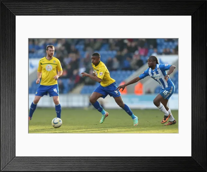 Framed Print : Bean vs. Akpom: A Sky Bet League One Battle at Colchester United's Weston Homes Stadium Framed Print : Bean vs. Akpom: A Sky Bet League One Battle at Colchester United's Weston Homes Stadium
