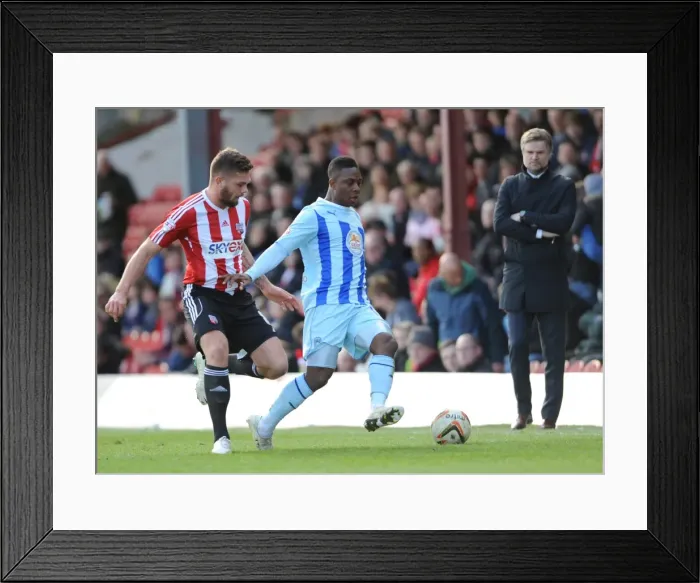 Framed Print : Battle of the Midfield: Franck Moussa vs. Jonathan Douglas - Brentford vs. Coventry City in Sky Bet League One Framed Print : Battle of the Midfield: Franck Moussa vs. Jonathan Douglas - Brentford vs. Coventry City in Sky Bet League One