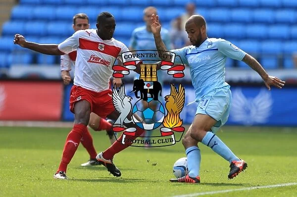 Action-Packed Rivalry: Lucas Akins vs. David McGoldrick at Ricoh Arena (Npower Football League One)