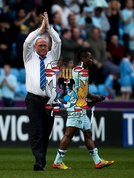 Andy Thorn's Coventry City: Unity with Fans Amidst Npower Championship Battle - Coventry City vs Portsmouth (24-03-2012, Ricoh Arena): Manager's Heartfelt Applause to Supporters