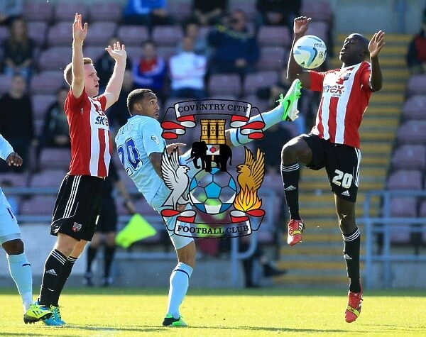 Battle for the Ball: Coventry City vs. Brentford - Coventry's Wilson Clashes with Forshaw and Diagouraga