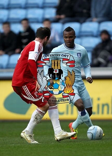 Battle for the Ball: Coventry City vs. Middlesbrough - A Clash Between Alex Nimely and Matthew Bates (Npower Championship, 21-01-2012)