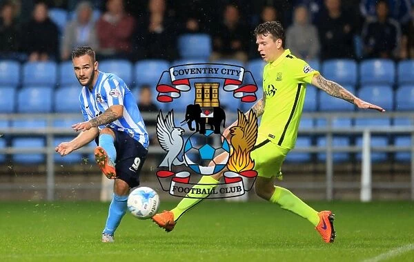 Battle for the Ball: Coventry City's Armstrong vs. Southend's Rea