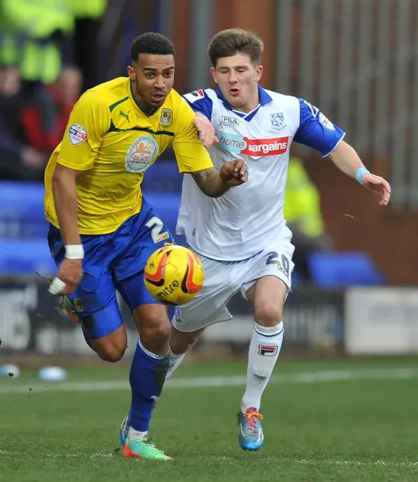 Framed Print : Battle for the Ball: Cyrus Christie vs. Matthew Kennedy - Sky Bet League One Clash Framed Print : Battle for the Ball: Cyrus Christie vs. Matthew Kennedy - Sky Bet League One Clash