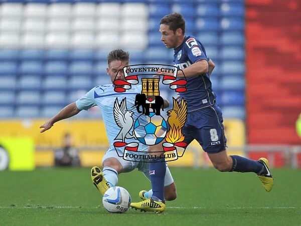 Battle for the Ball: James Bailey vs. Dean Furman - Coventry City vs. Oldham Athletic