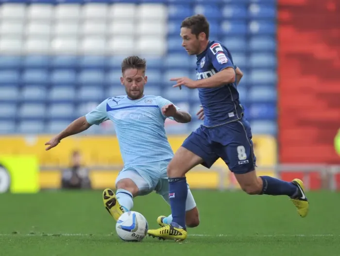 Framed Print : Battle for the Ball: James Bailey vs. Dean Furman - Coventry City vs. Oldham Athletic Framed Print : Battle for the Ball: James Bailey vs. Dean Furman - Coventry City vs. Oldham Athletic