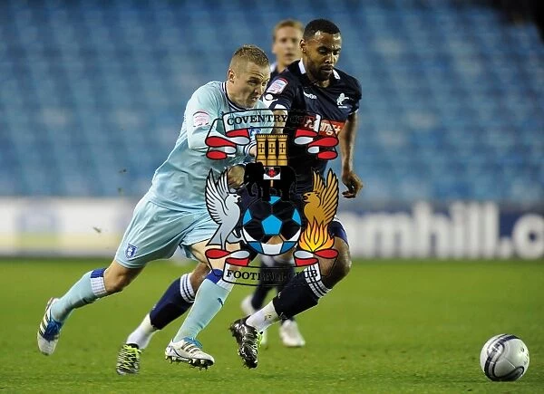 Battle for the Ball: McSheffrey vs. Trotter in the Intense Npower Championship Clash between Coventry City and Millwall