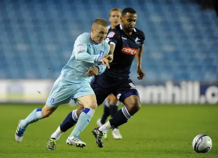 Framed Print : Battle for the Ball: McSheffrey vs. Trotter in the Intense Npower Championship Clash between Coventry City and Millwall Framed Print : Battle for the Ball: McSheffrey vs. Trotter in the Intense Npower Championship Clash between Coventry City and Millwall