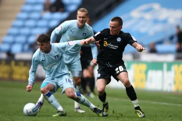 Framed Print : Battle for the Ball: Norwood vs. Taylor - Coventry City vs. Peterborough United, Npower Championship (07-04-2012)