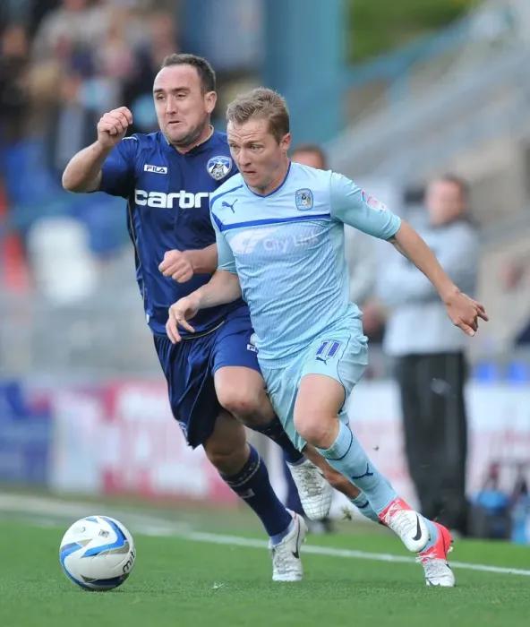 Framed Print : Battle for Ball Supremacy: McSheffrey vs Croft in Coventry City's Npower League One Clash at Oldham Athletic's Boundary Park Framed Print : Battle for Ball Supremacy: McSheffrey vs Croft in Coventry City's Npower League One Clash at Oldham Athletic's Boundary Park