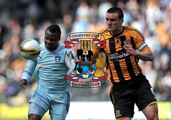 Battle for the Ball: Tchuimeni-Nimely vs. Hobbs at KC Stadium (Coventry City vs. Hull City, Npower Football League Championship, 31-03-2012)