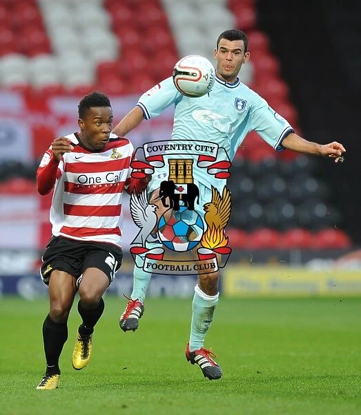 Battle for the Ball: Thomas vs. Dumbuya in Coventry City's Championship Clash