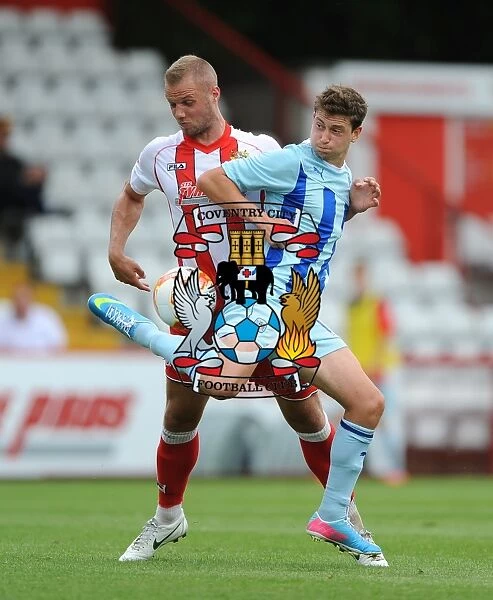 Battle for the Ball: A Tight Tussle between Harry Worley and Shaun Miller in Coventry City's Pre-Season Clash against Stevenage