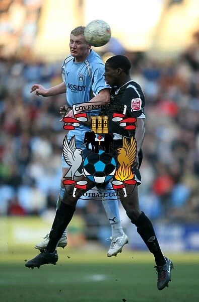 Battle for the FA Cup: Robbie Simpson vs. Leon Barnett - Aerial Clash at The Ricoh Arena (Coventry City vs. West Bromwich Albion, FA Cup Fifth Round, 2008)