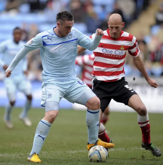 Framed Print : Battle in Football League One: Coventry City vs Doncaster Rovers at Ricoh Arena - Callum Ball vs Rob Jones Framed Print : Battle in Football League One: Coventry City vs Doncaster Rovers at Ricoh Arena - Callum Ball vs Rob Jones
