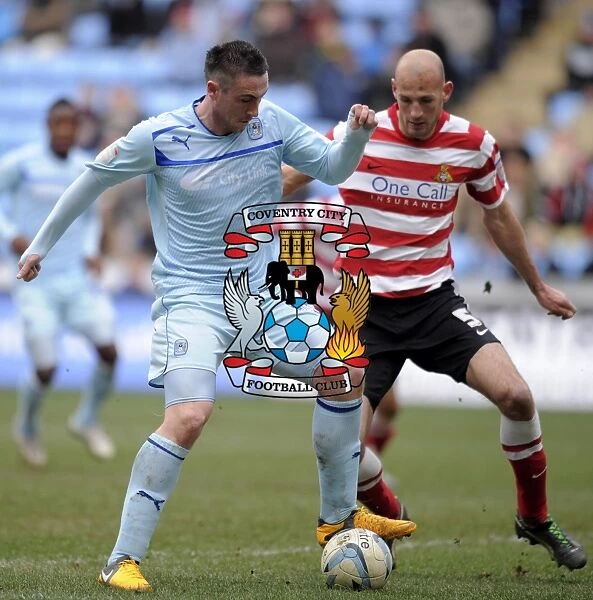 Battle in Football League One: Coventry City vs Doncaster Rovers at Ricoh Arena - Callum Ball vs Rob Jones