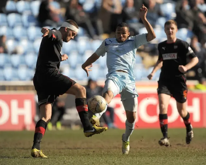 Framed Print : Battle for Football League One Supremacy: Coventry City vs Brentford - Christie vs Dean Clash at Ricoh Arena