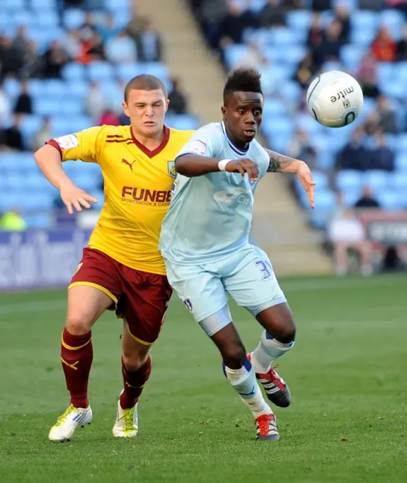 Framed Print : Battle for Supremacy: Coventry City vs. Burnley - Trippier vs. Bigirimana in Npower Championship Clash Framed Print : Battle for Supremacy: Coventry City vs. Burnley - Trippier vs. Bigirimana in Npower Championship Clash